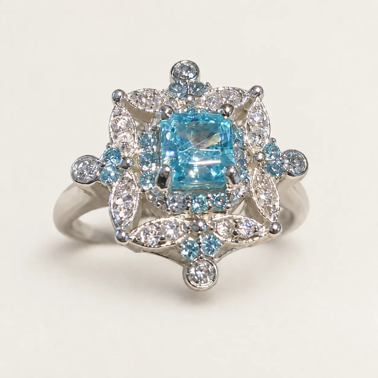 Close view of the aquamarine center and leaf-shaped details surrounding the face of Natasha’s ring.