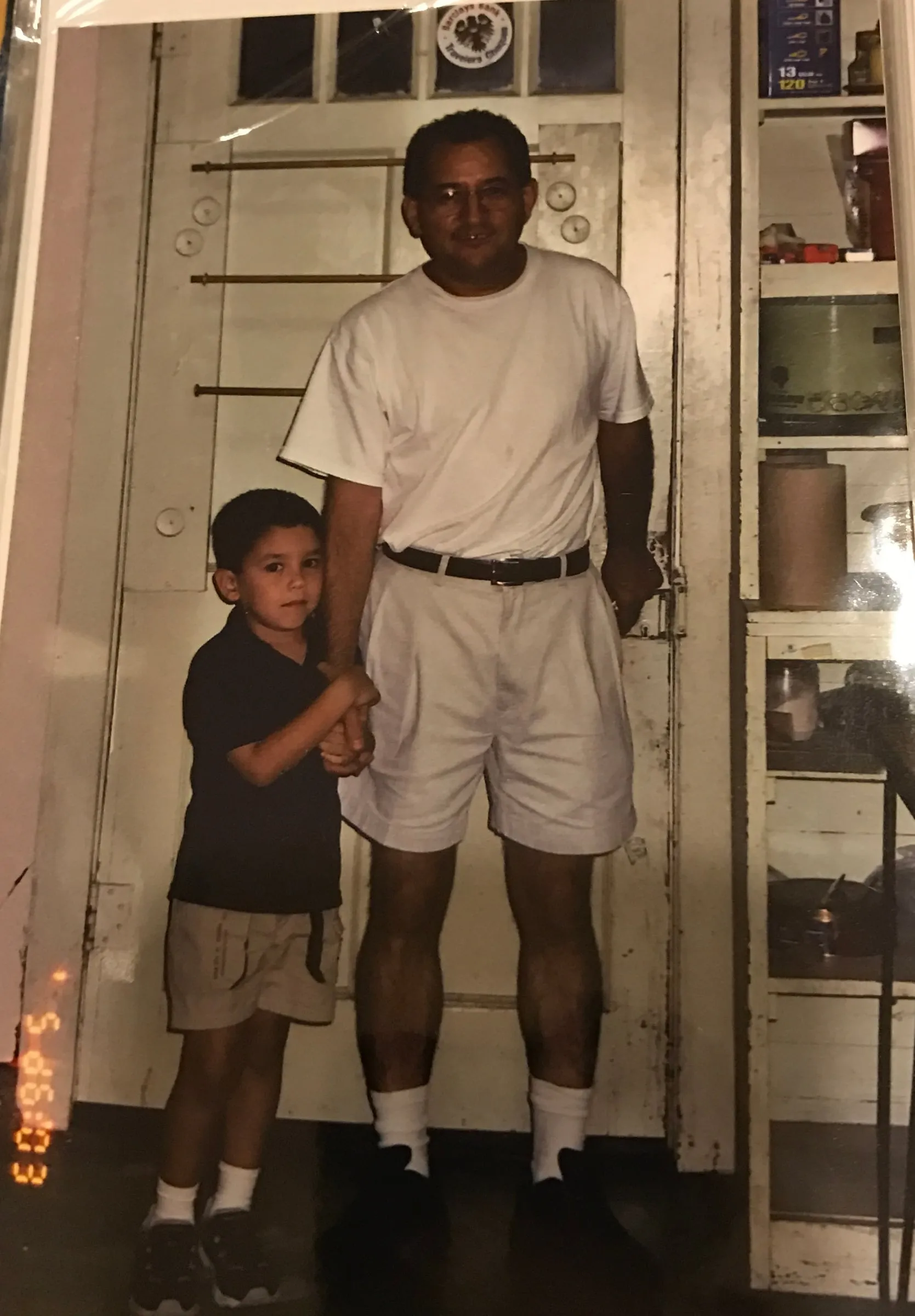Gabriel as a young boy holding his grandfather’s hand.